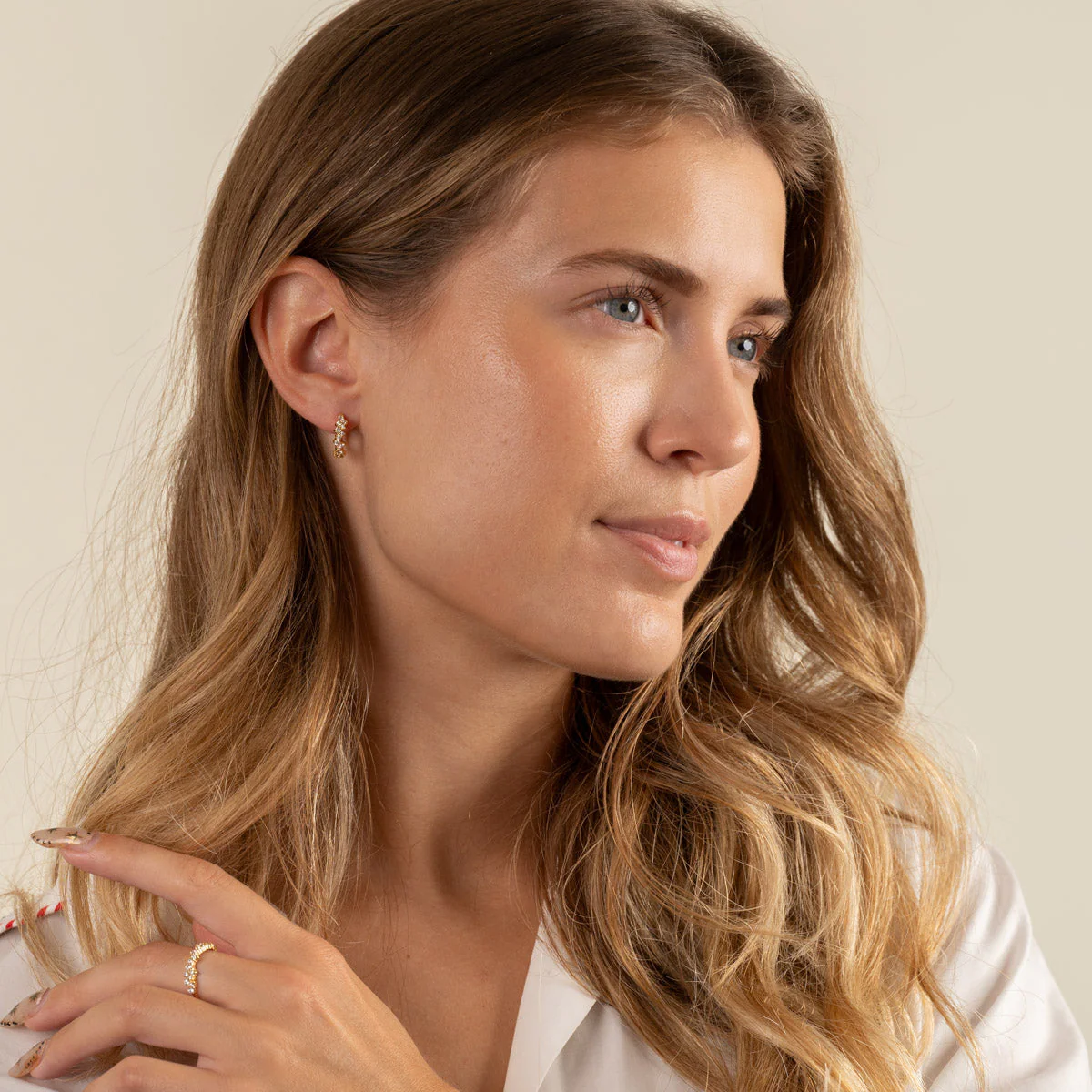 CLAIR CRYSTAL GOLDEN SMALL HUGGIE EARRING - Image 7