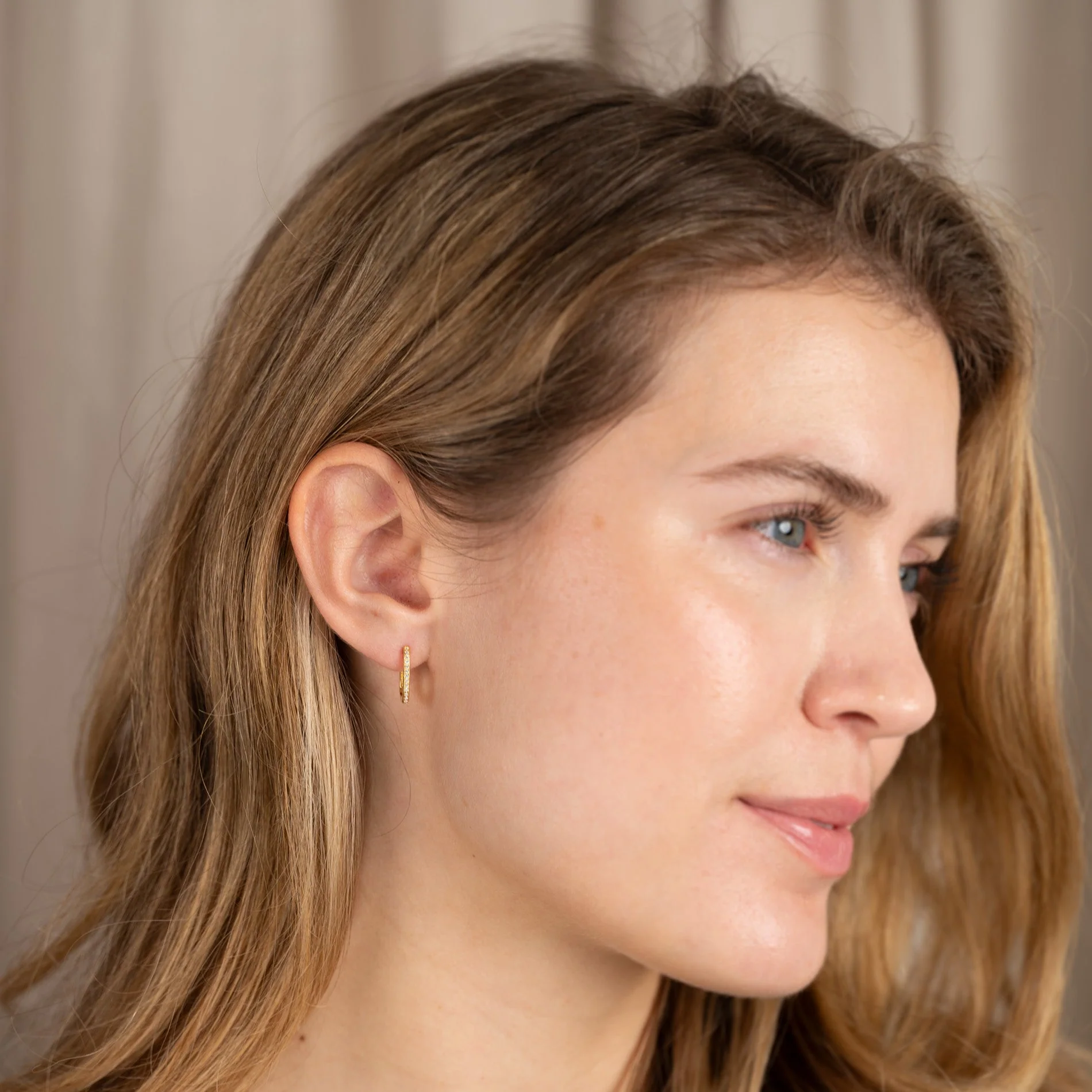 DANIA CRYSTAL GOLDEN HUGGIE EARRING - Image 7