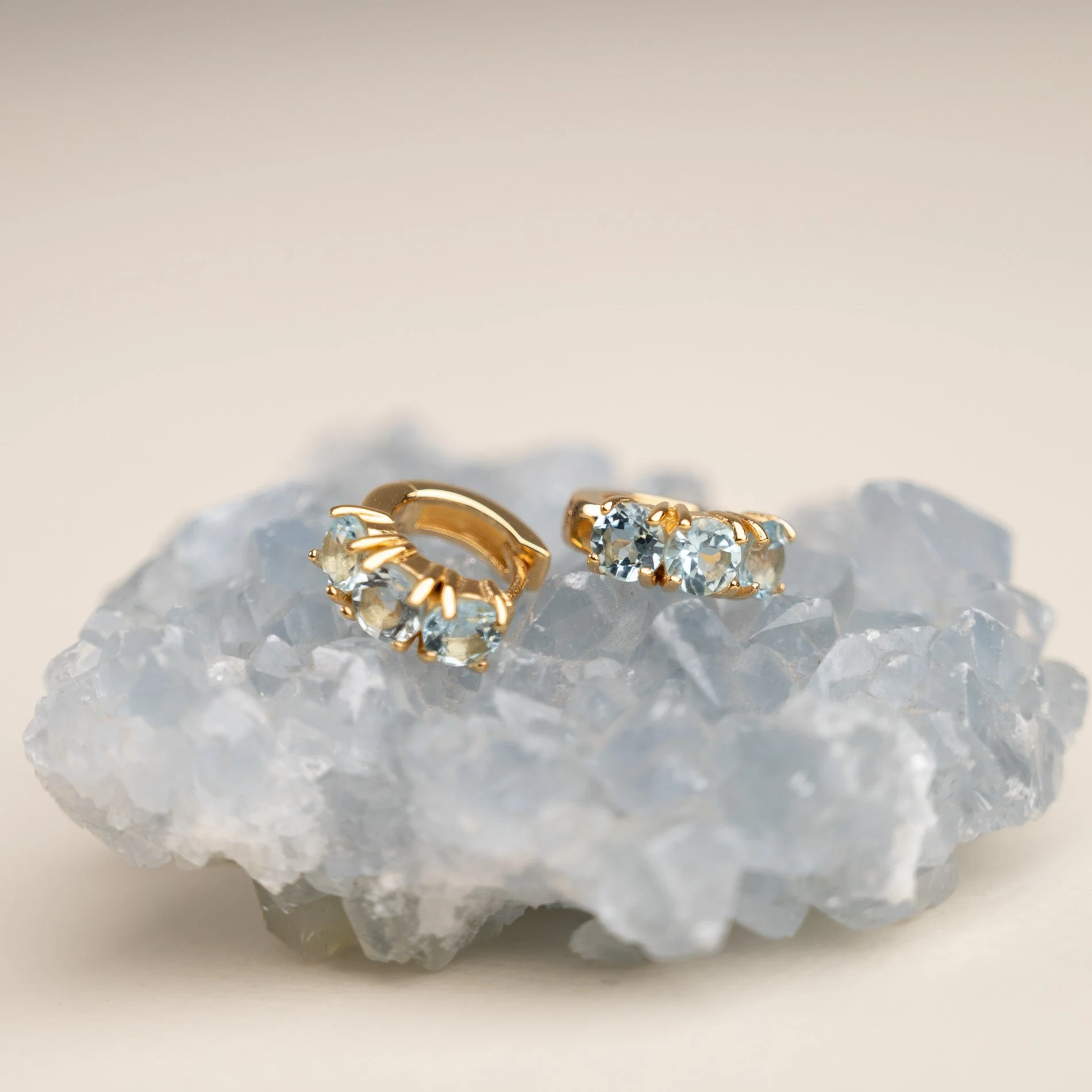 GEMMA BLUE TOPAZ GOLDEN HUGGIE EARRING - Image 4