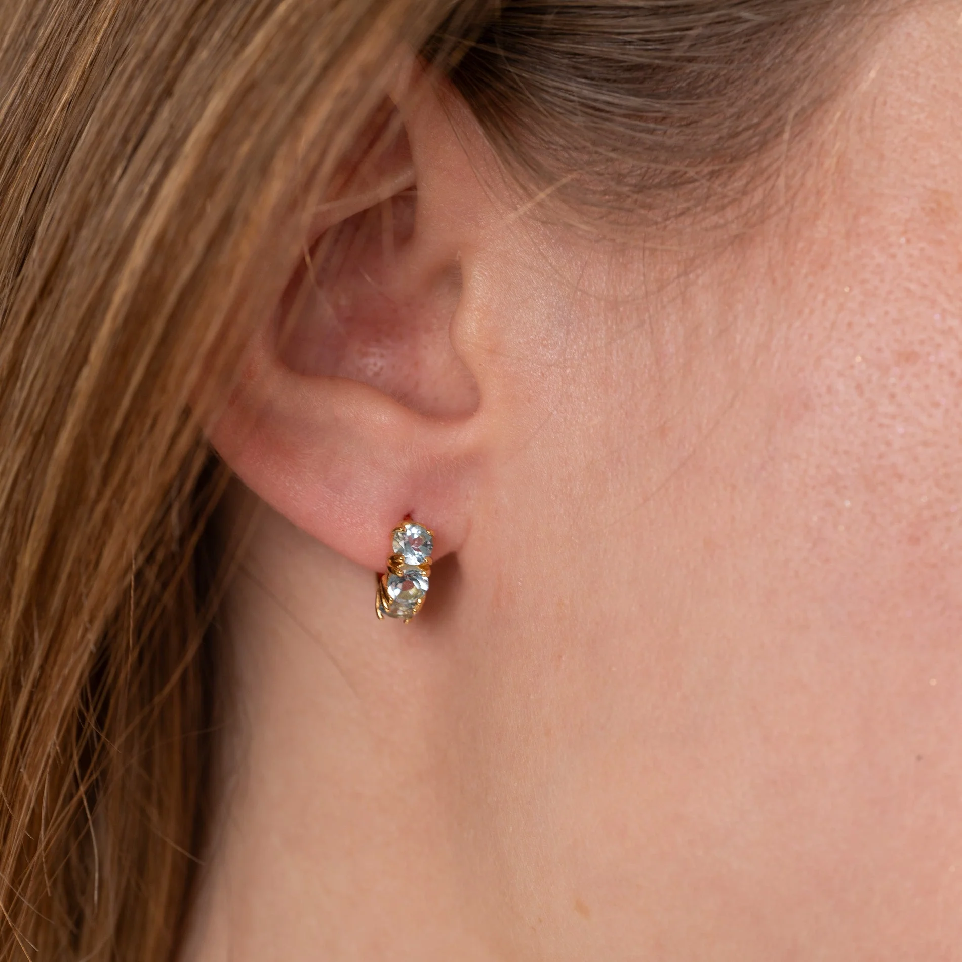 GEMMA BLUE TOPAZ GOLDEN HUGGIE EARRING - Image 5