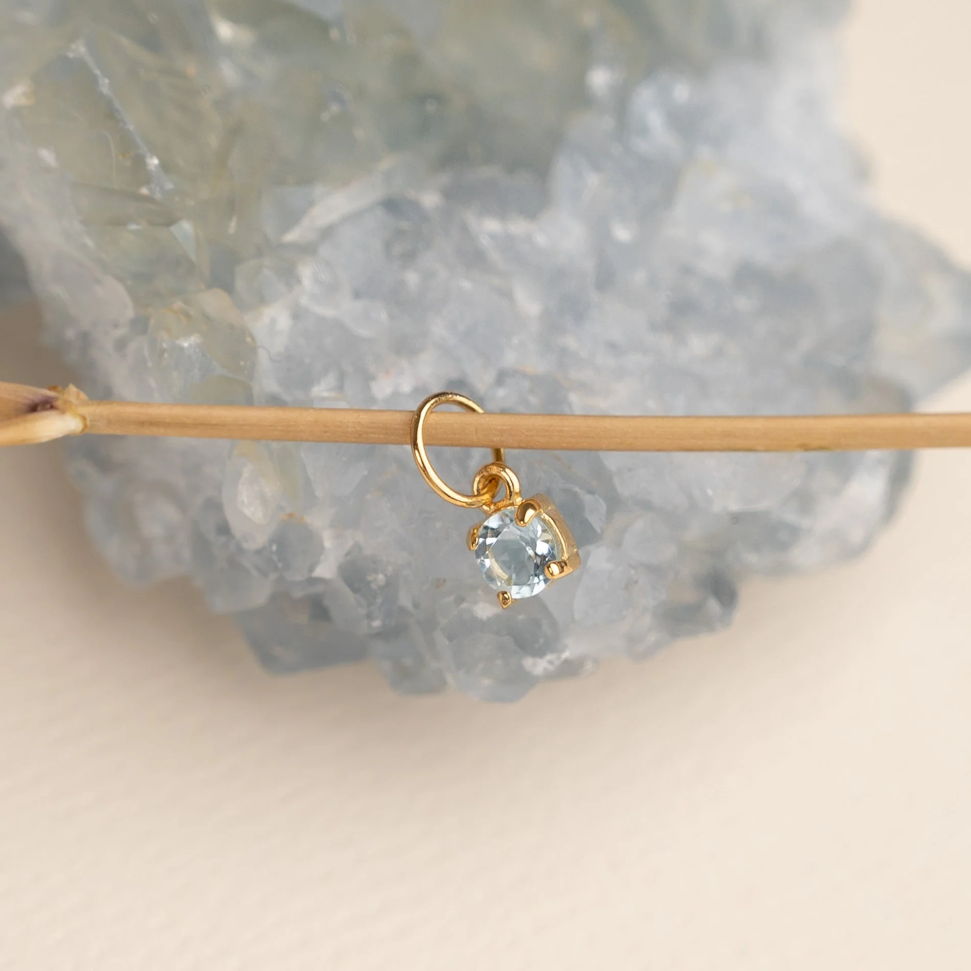 GEMMA BLUE TOPAZ GOLDEN PENDANT
