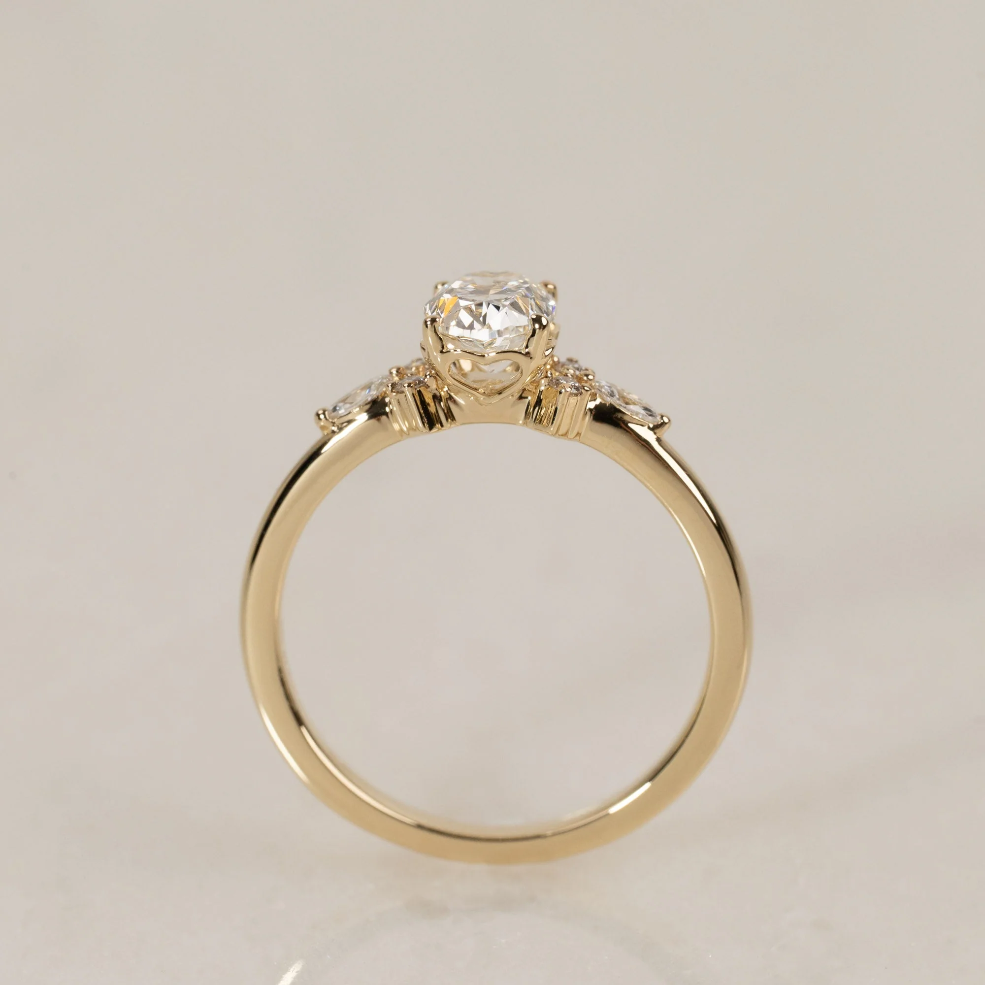 HEART-SET OVAL-CUT SIDESTONE DIAMOND RING - 0.75ct
