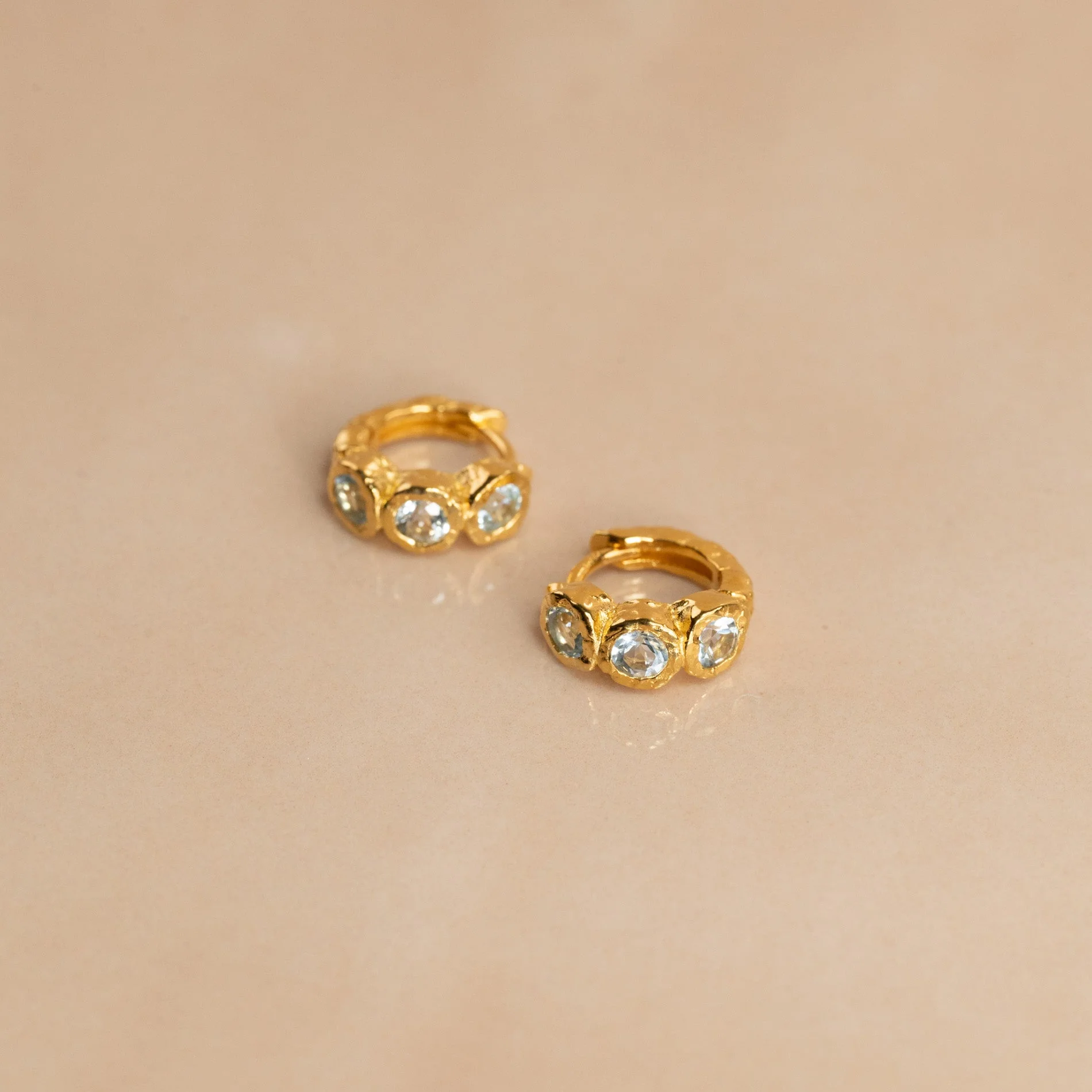 SELENE BLUE TOPAZ GOLDEN HUGGIE EARRING - Image 5