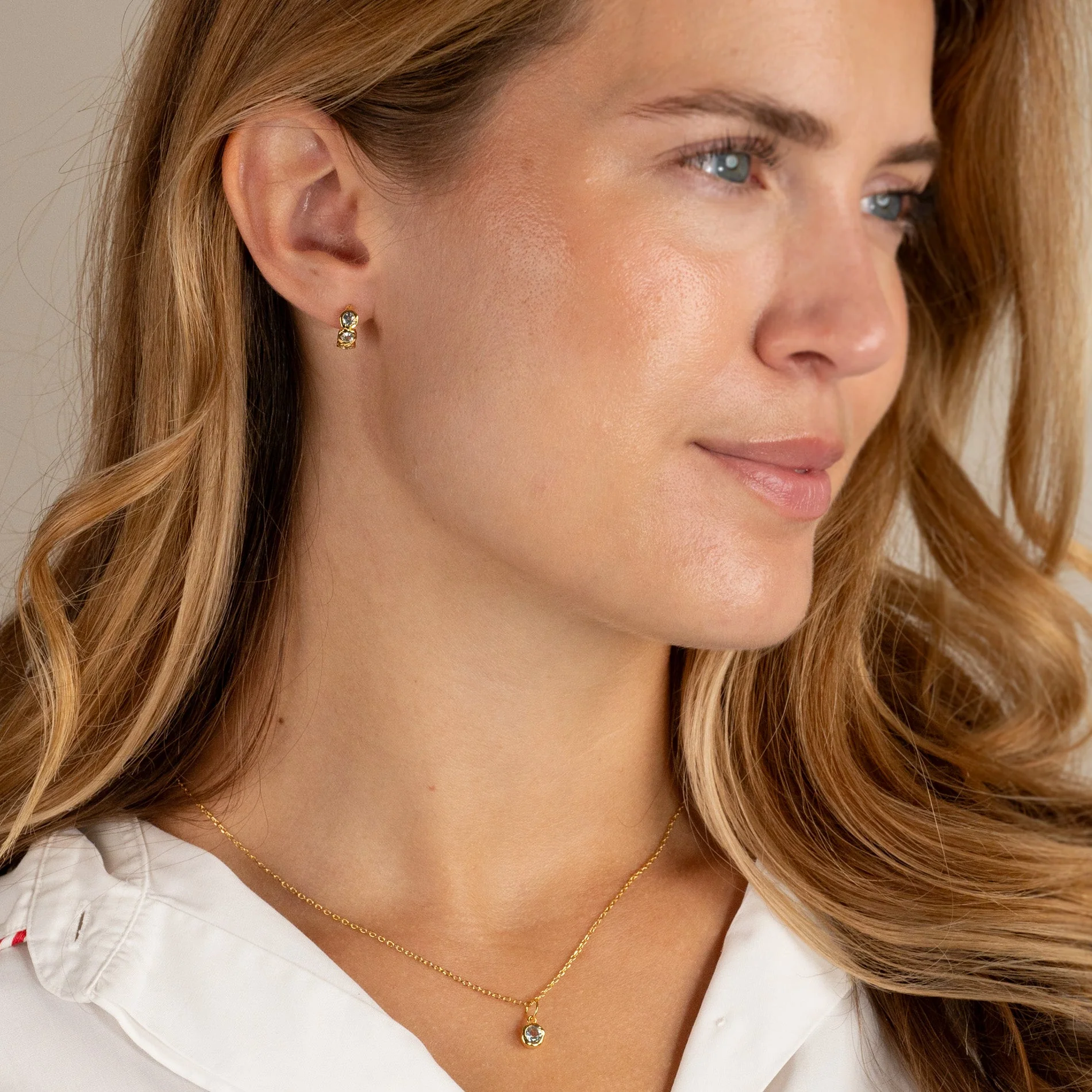 SELENE BLUE TOPAZ GOLDEN HUGGIE EARRING - Image 8