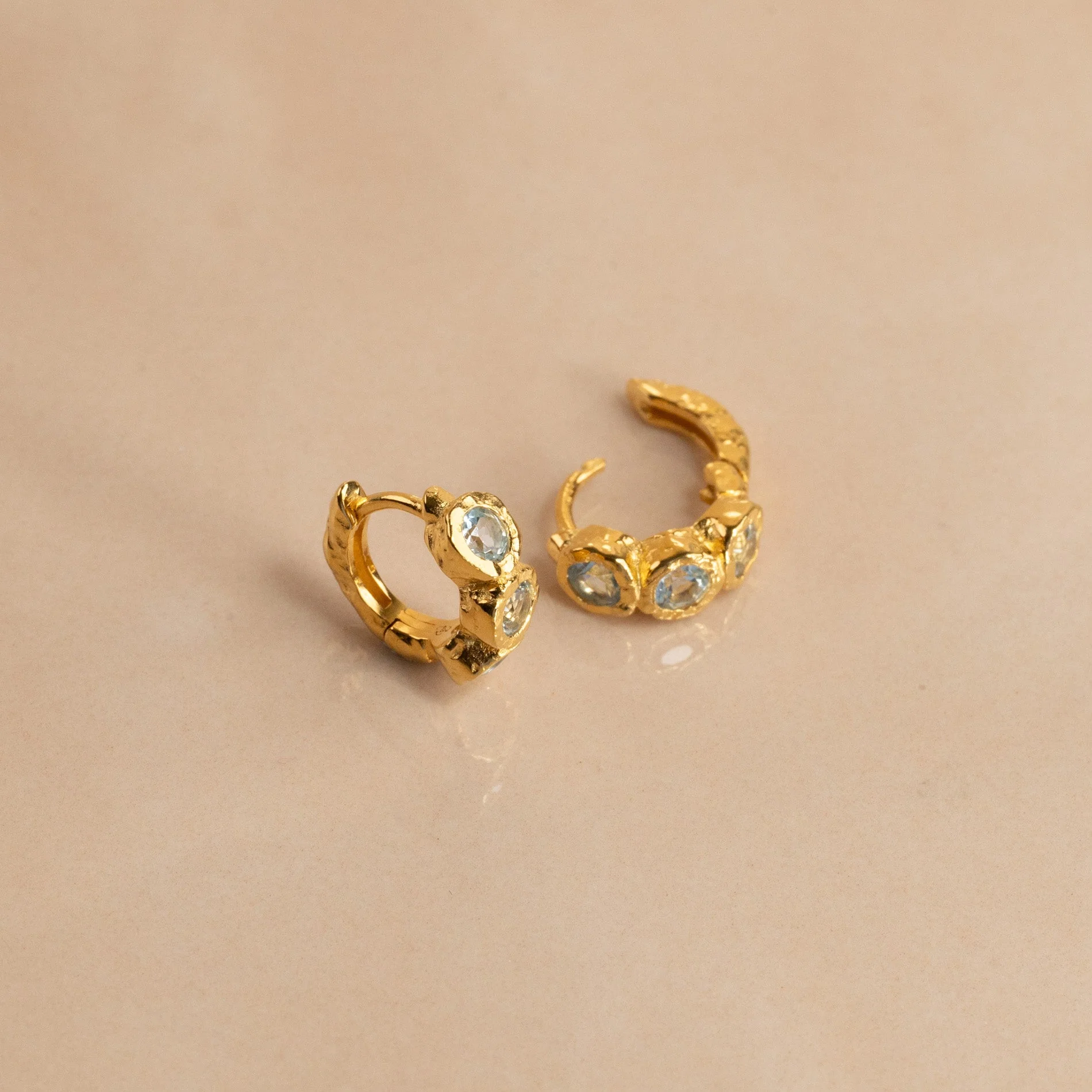 SELENE BLUE TOPAZ GOLDEN HUGGIE EARRING - Image 9